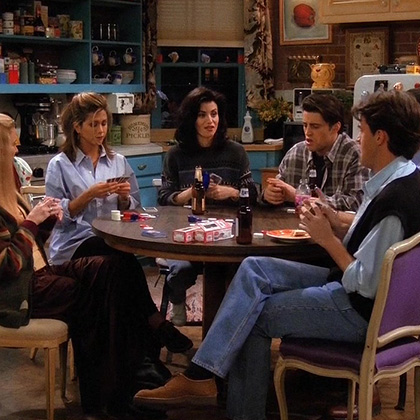 Monica and Friends at the table in her apartment